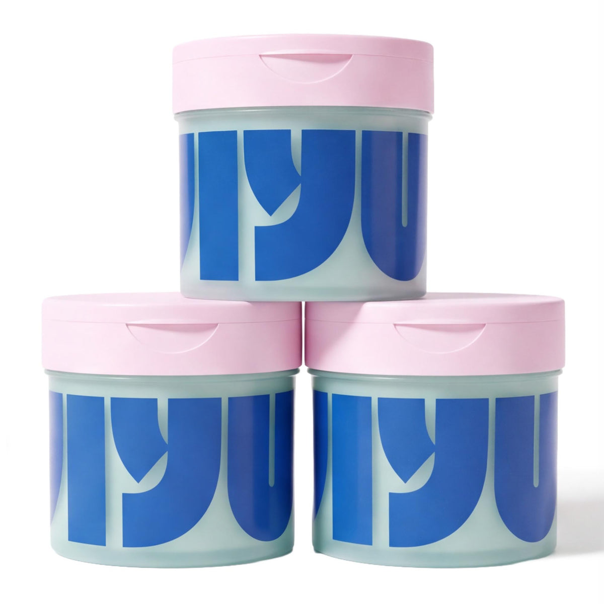 Three mint-green jars of face pads with pink flip lids stacked in a pyramid