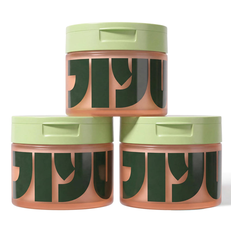 Three frosted peach jars of toner pads with light green lids stacked in a pyramid, JIYU lettering facing forward